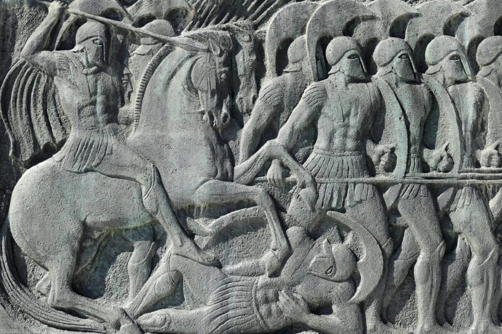 Intricate stone relief depicting an ancient Greek battle scene in Thessaloniki, Greece.