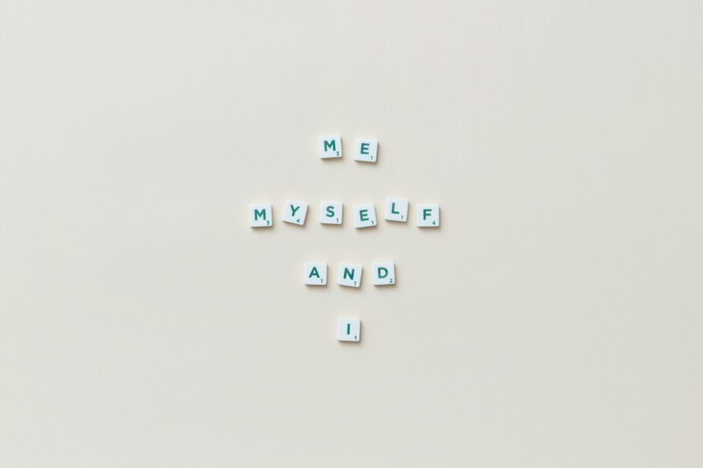 نيتشه: هذا هو الإنسان – البوح الفلسفي الأول Minimalist composition of Scrabble tiles spelling 'Me, Myself, and I' on a white background.